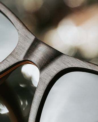 Sunglasses made with natural ebony wood and 100% UV protection glass. Handmade in California